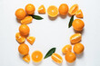 Frame made of fresh juicy oranges on light background