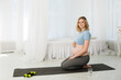 © Irina - blonde pregnant woman doing yoga in the bedroom, Morning exercises, morning exercises