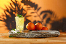 Wooden Table On A Hot Tropical Evening With Oranges At Sunset 