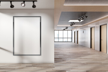 Wall Mural - Black vertical frame Mockup hanging on wall. Mock up of a billboard in modern wooden office interior 3D rendering