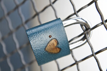 Closeup Shot Of A Hanging Lock On A Fence As A Sign Of Eternal Love