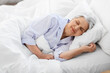 © Syda Productions - old age and people concept - senior woman sleeping in bed at home bedroom