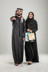 Poster - ARabian couple isolated on grey background