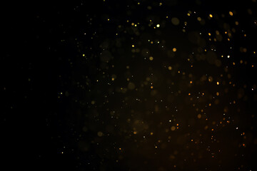 texture of gold dust or drops on a black background, overlay