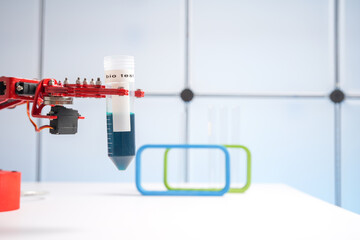 Sticker - Robot arm with test tube  with biological sample in science laboratory