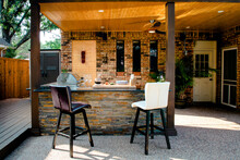 New And Modern Outdoor Kitchen On A Sunny Summer Evening, Dinner Preparation
