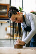 © Inuk Studio/Stocksy - Female carpenter working with plane in workshop