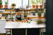 © Inuk Studio/Stocksy - Focused artisan woman working in restoration workshop