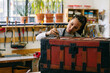 © Inuk Studio/Stocksy - Craftswoman varnishing wooden chest in workshop