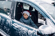 © Léa Jones/Stocksy - boy with Santa hat in car, leaving his cousins.