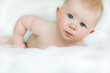 © Luke Liable/Stocksy - Newborn Boy laying on bed