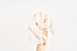 © Martí Sans/Stocksy - Cosmetic sheet mask on female hand