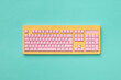 © Yaroslav Danylchenko/Stocksy - Papercraft colorful computer keyboard.