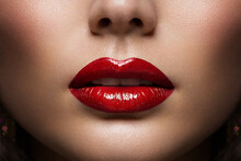Red Lips Close Up. Woman Beauty Face Make Up. Glossy Shiny Lipstick Cosmetic. Model With Plump Lips Sexy Mouth