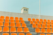 © Jeongho Byeon/Stocksy - The orange color bleachers are empty inside the stadium