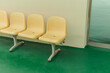 © Jeongho Byeon/Stocksy - Green floor and yellow chair