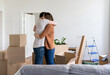 © Hernandez & Sorokina/Stocksy - Hugging Between Boxes At New Home