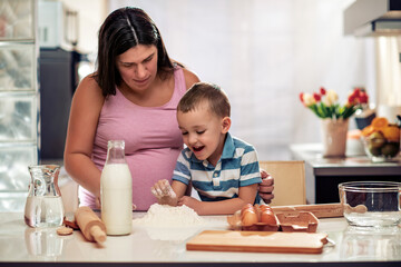 Canvas Print - Family cooking together in kitchen