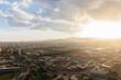 © Marcos Osorio/Stocksy - View of the city of Barcelona from a helicopter at sunset