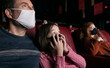 © Sean Locke/Stocksy - Movies: Little Girl Scared During Movie