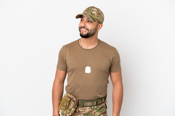 Young arab soldier man isolated on white background thinking an idea while looking up