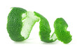 Peel of fresh lime fruit isolated on a white background. Lime zest spiral.