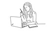 © Anna - Woman holding pen in front of laptop. Learning, reading, working concept.
