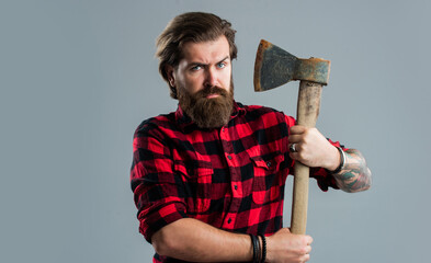 Wall Mural - handsome bearded guy with beard and moustache hold ax, woodsman