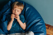 © Olga Moreira/Stocksy - 5 years old kid sitting in beanbag chair