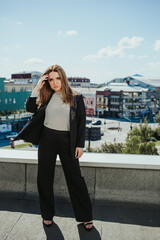 Poster - Elegant female from Bosnia and Herzegovina posing on the roof