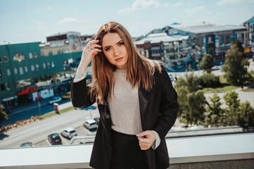 Canvas Print - Pretty Caucasian lady wearing a blazer and posing on a bridge