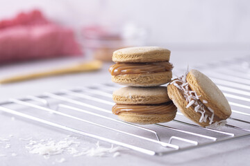 Sticker - Closeup shot of delicious macarons of various fillings stacked on a grid