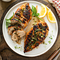 Wall Mural - Balsamic grilled chicken breast on a board