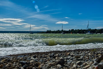 closeup shot of coastline with sea waves on a clear sunny day