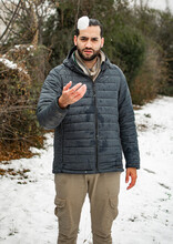 Young Sexy Man In Snow Throwing Snowball