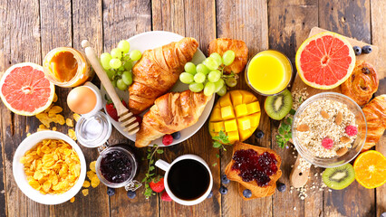 Wall Mural - breakfast with coffee cup, croissant and fresh fruits
