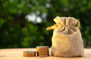 Poster - Stack of coin on table background and business or finance saving money, Advertising coins of finance and banking, Gold coins stacked on table background