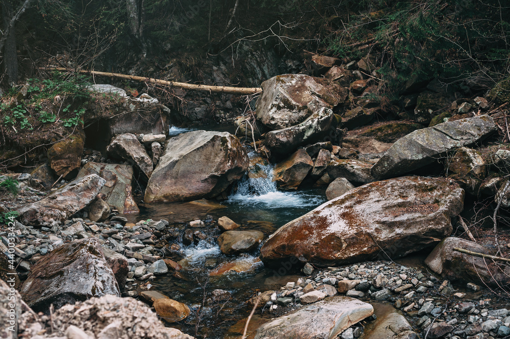 Background water and stone. Small waterfall that flows over the ...