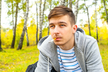 Canvas Print - Young Man smoke a Cigarette