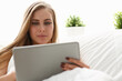© H_Ko - woman work winh laptop stay in bed early morning