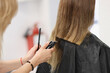 © H_Ko - Hairdresser doing hair cutting of woman using clipper in salon closeup