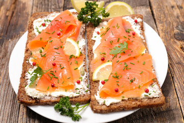 Wall Mural - bread toast with smoked salmon and cheese cream