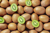 Many ripe kiwi as background
