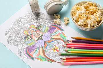 Sticker - Coloring picture headphones, popcorn and pencils on table