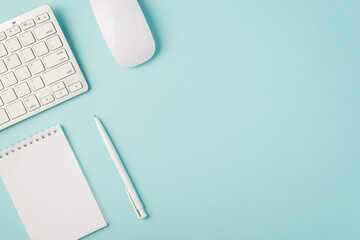 top view photo of white keyboard mouse organizer and pen on isolated pastel blue background with cop