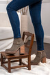 © Alejandro Piorun - woman legs wearing brown black leather fashion shoes with casual clothes with very stylish bottom