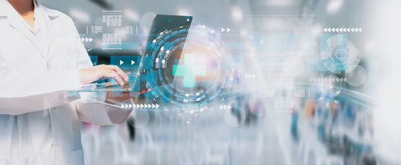 Doctor holding laptop computer with modern medical sign interface,medicine network health care online connection,concept business and medicine with profit,benefit,health and insurance for patients