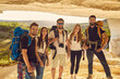 © Studio Romantic - Groups of tourists with backpacks in a cave in the mountains travel along the excursion route. An active extreme type of recreation spot. Walking tour. Hiking.