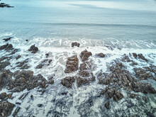 Aerial Drone Image Of A Rocky Beach On The Maine Coast With The Waves Washing Up On The Rocks