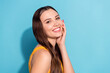 © deagreez - Photo portrait girl with long hair smiling in casual clothes touching cheeks isolated pastel blue color background copyspace